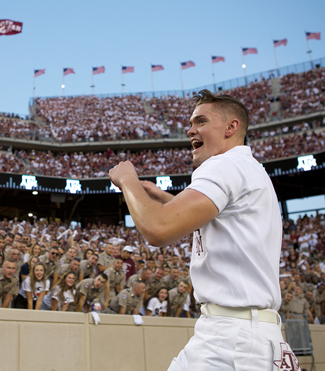 Yell Leaders in front of crowd at Midnight Yell in Kyle Field